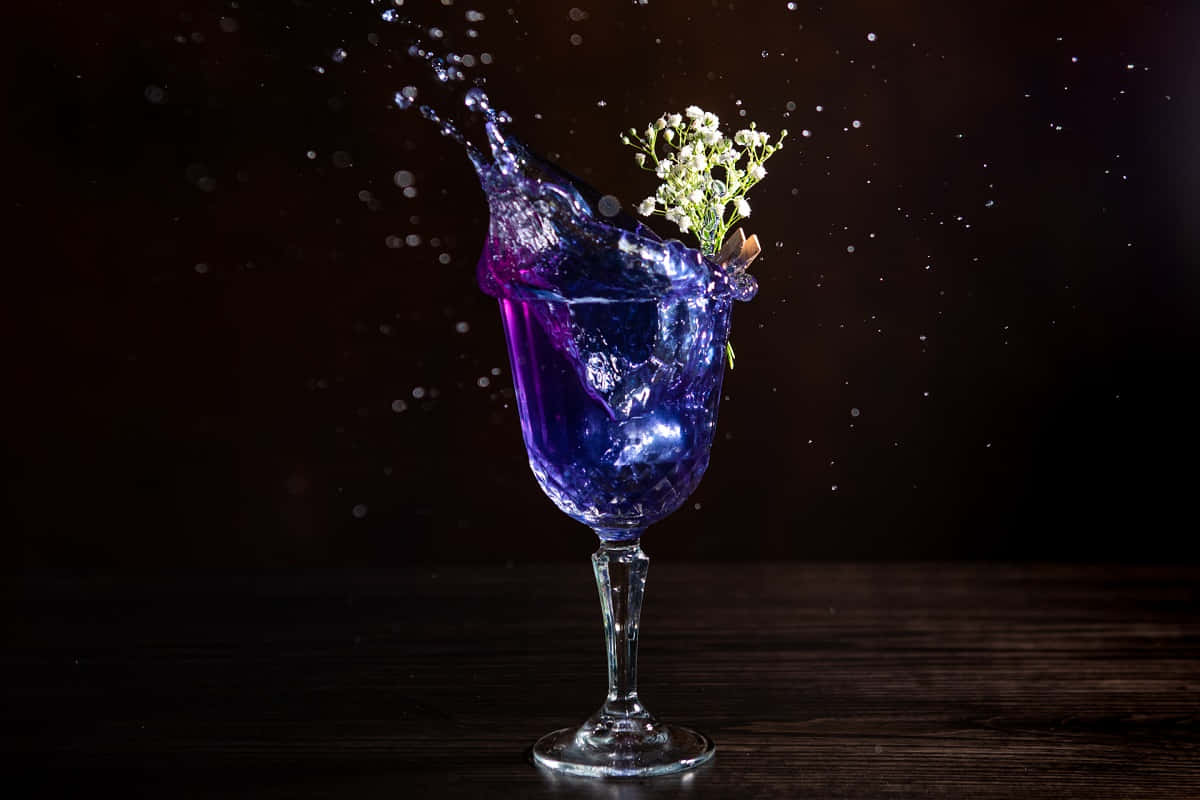 Splashing Blue Cocktail Drinks Glass Background