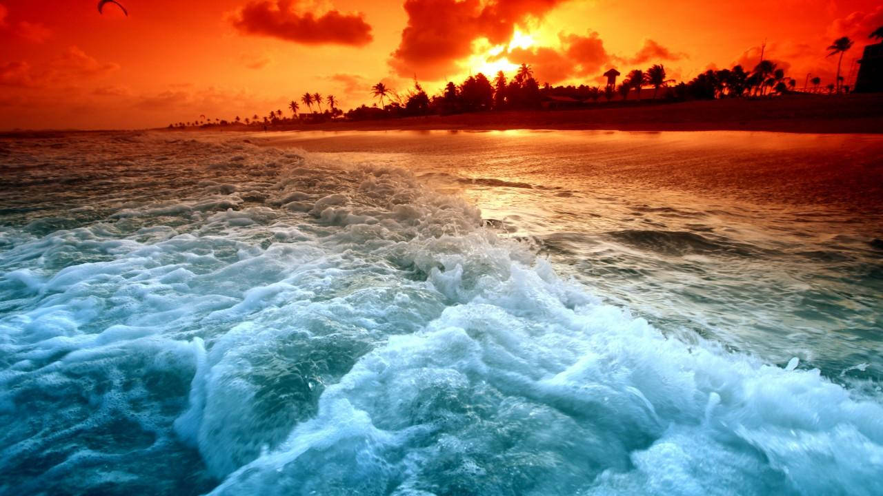Splashing Waves On Beach Sunset Background