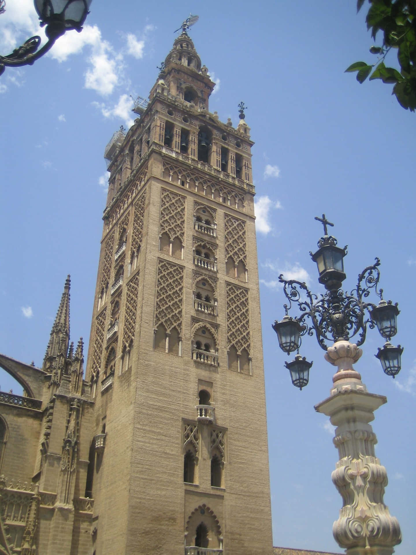Splendid View Of The Giralda Tower Of Seville Cathedral Background
