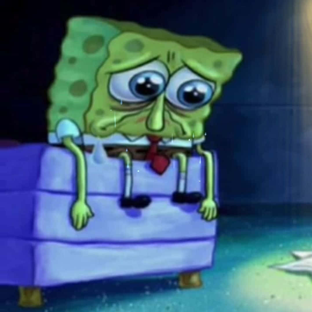Spongebob Crying On The Bed Background