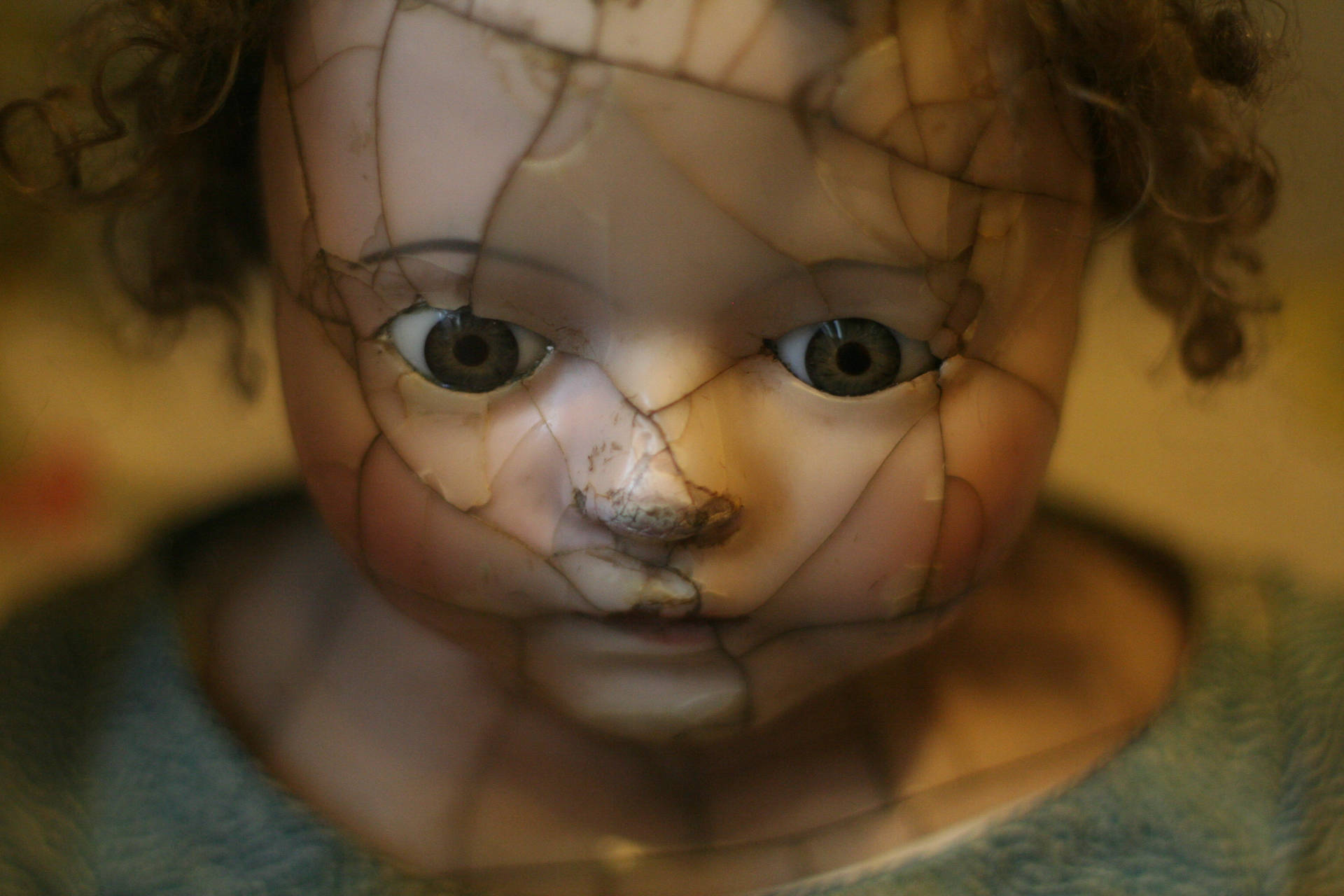 Spooky Damaged Porcelain Doll Background