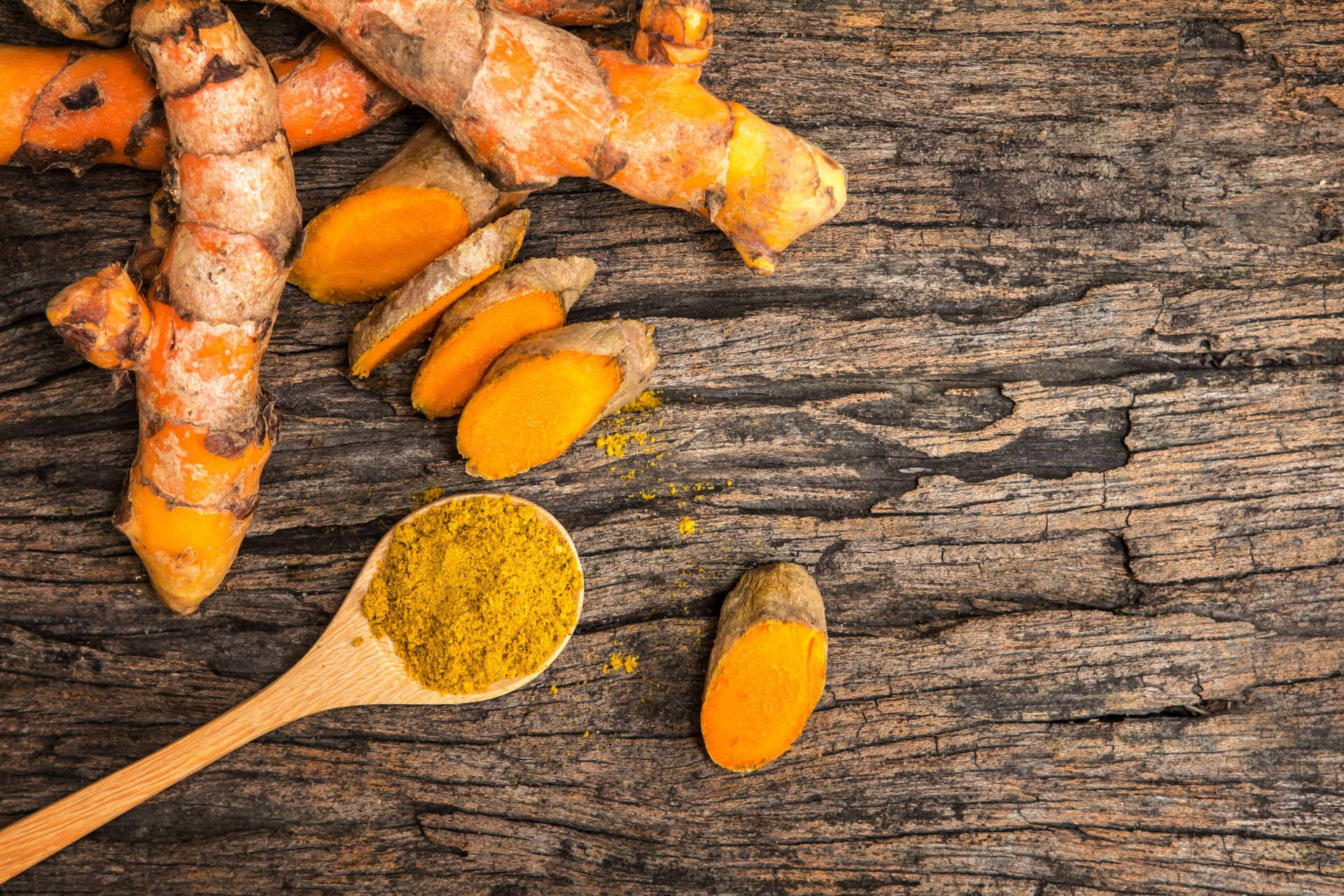 Spoon Of Turmeric Powder Background