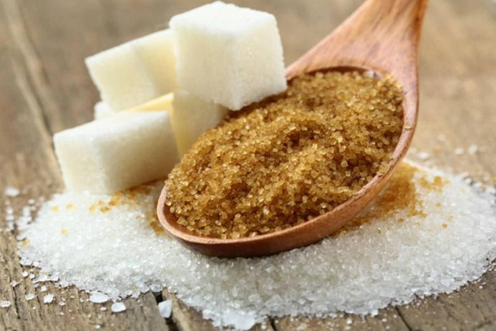 Spoonful Of Brown Sugar With White Cubes Aesthetic Background