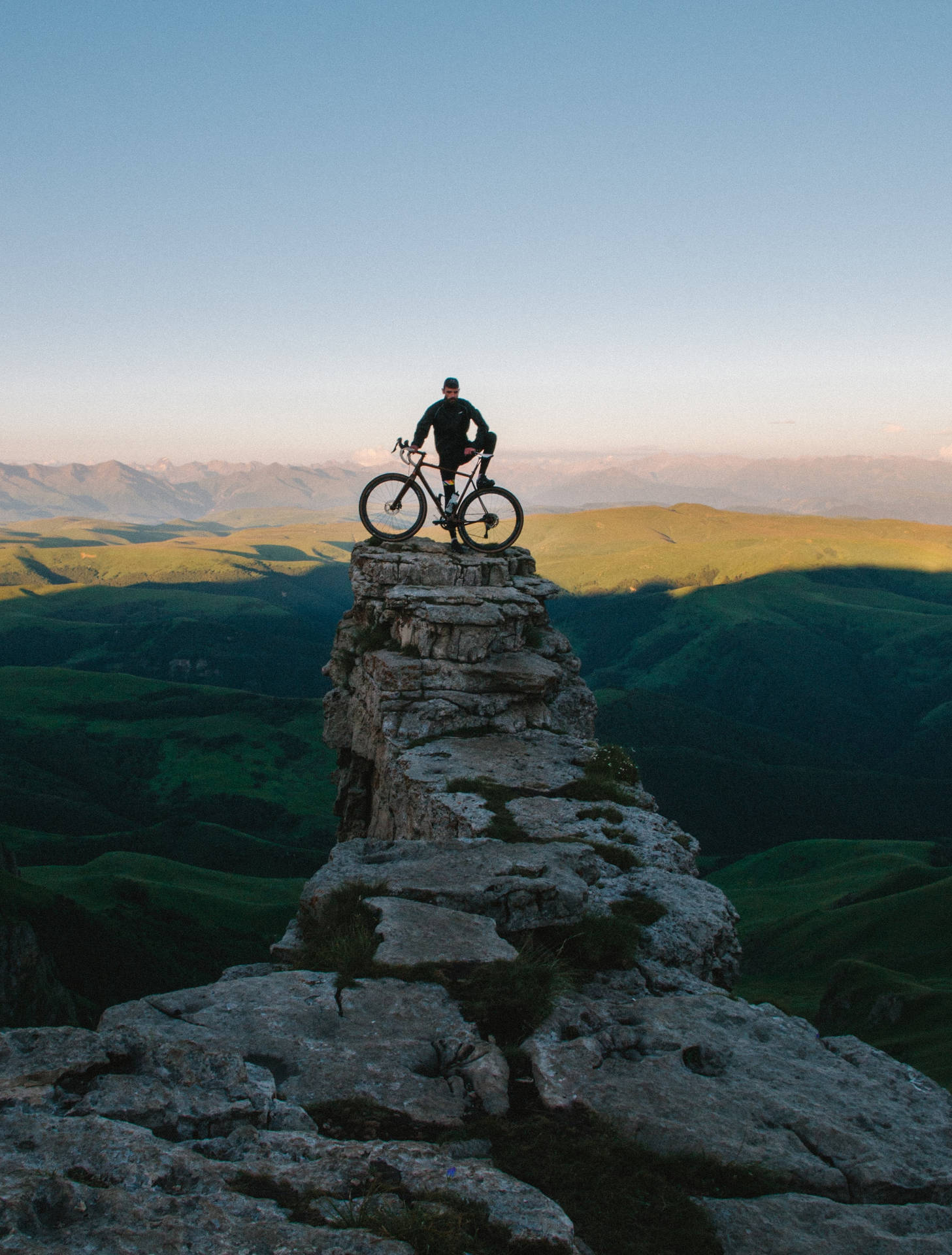 Sport Biker On A Cliff