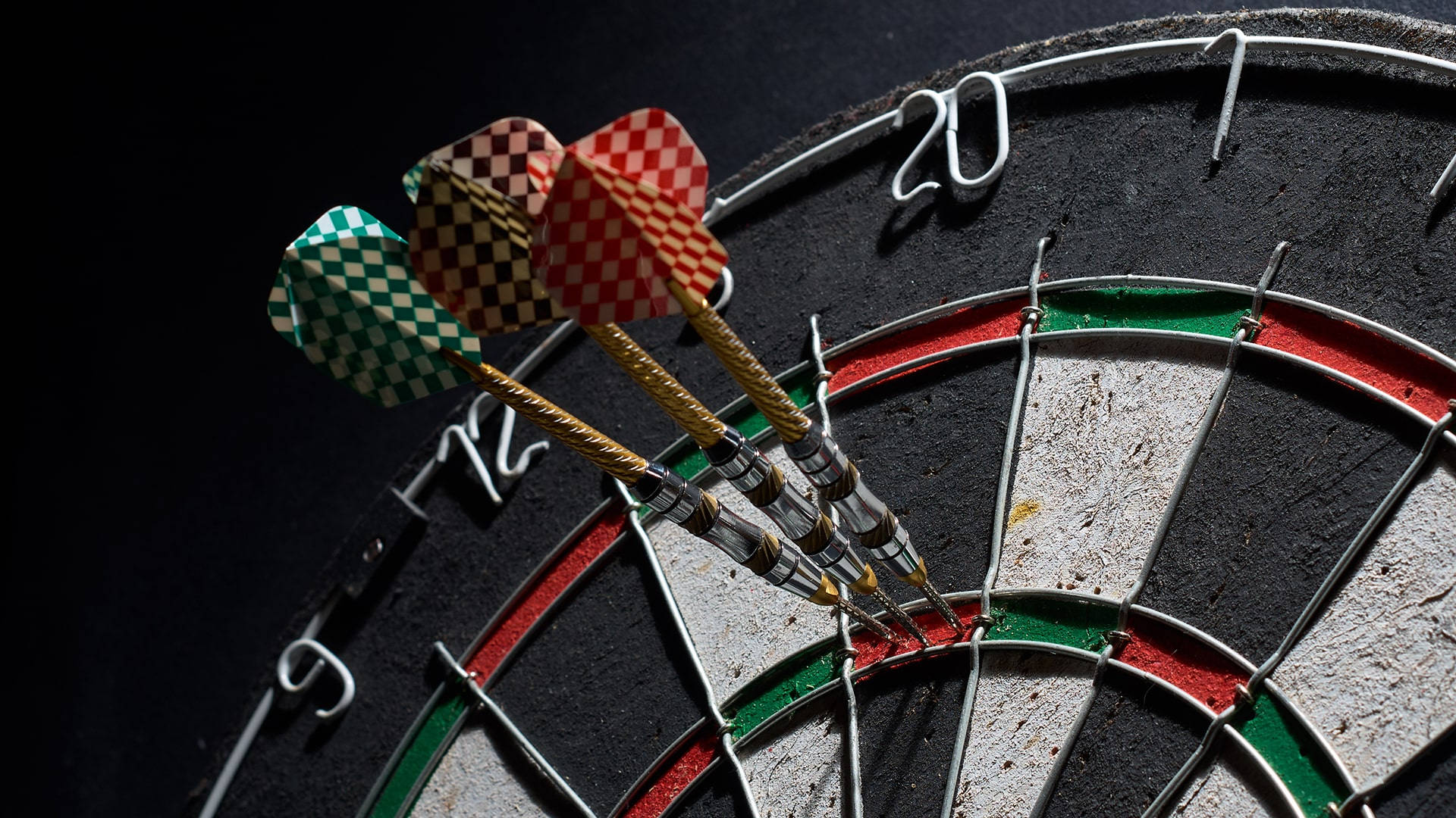 Sport Three Darts In Dartboard Background