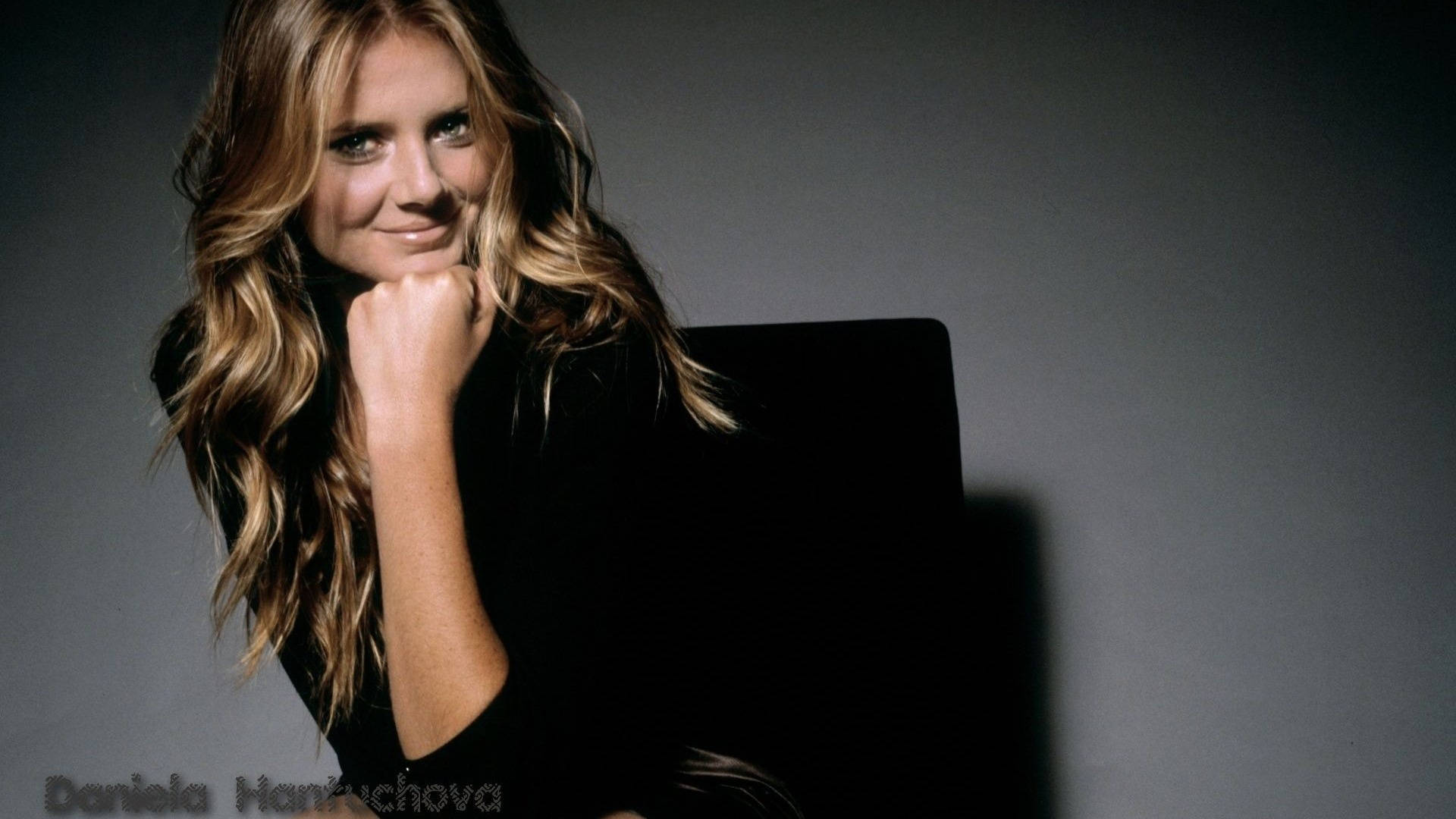 Sports Enthusiast Daniela Hantuchova Posing With A Gleaming Smile Background