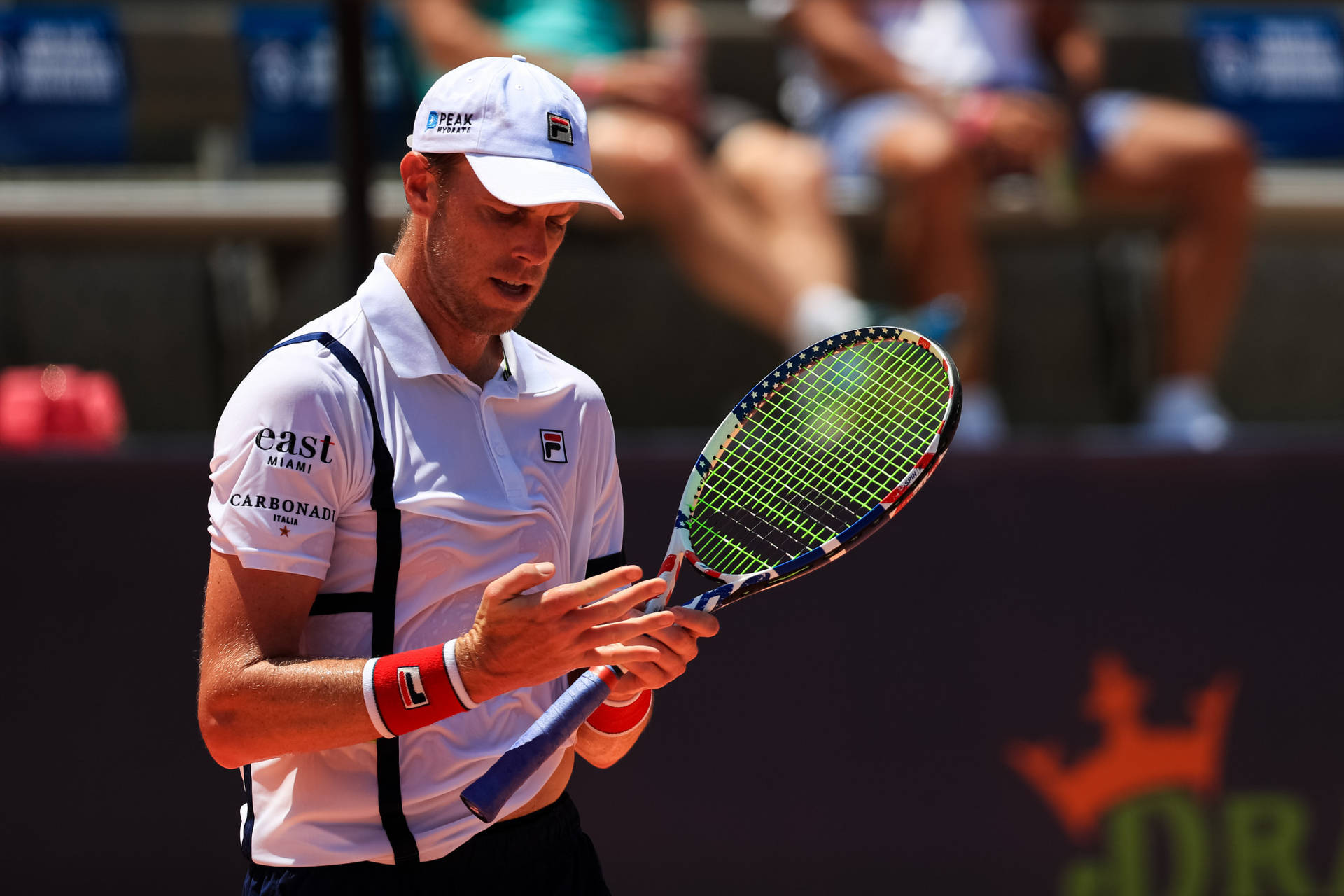 Sportsman Sam Querrey With Racket Background