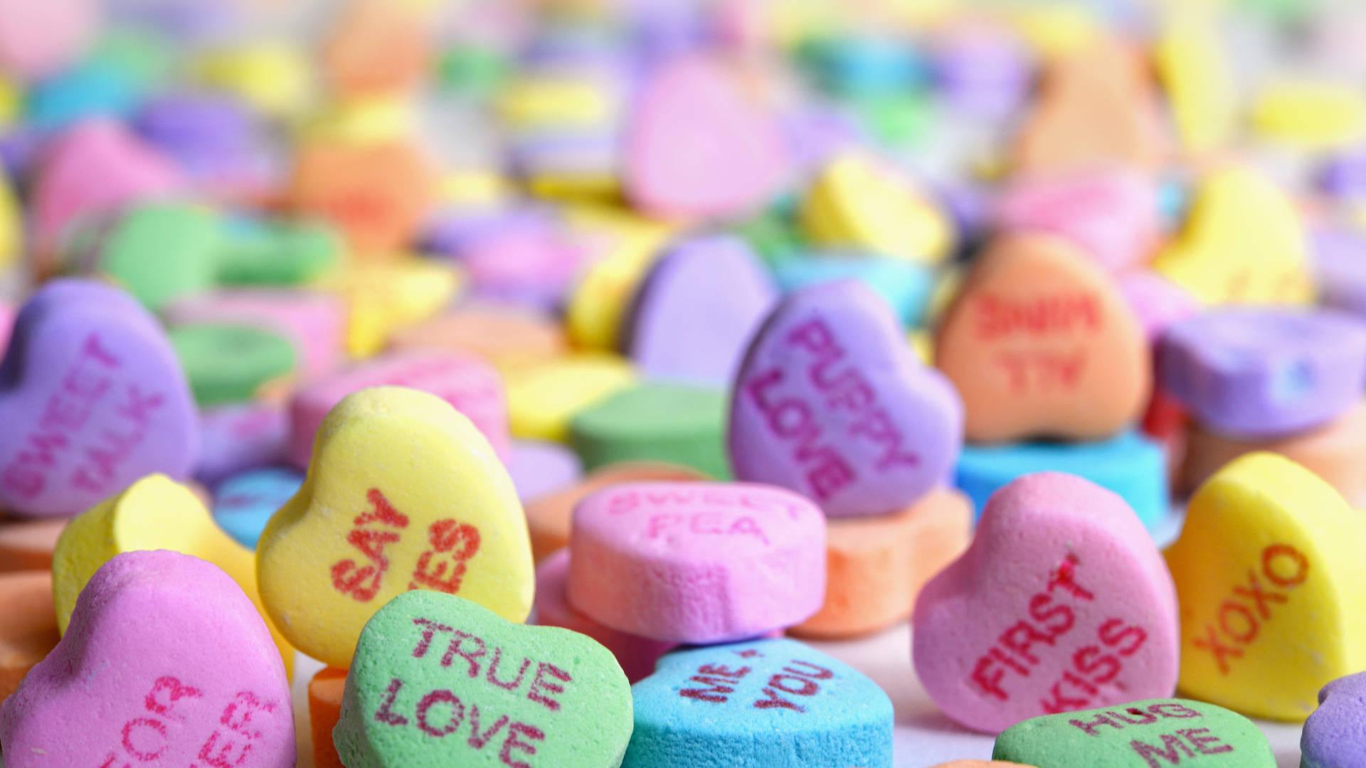 Spread The Love This Season With Colorful Pastel Candy Hearts Background