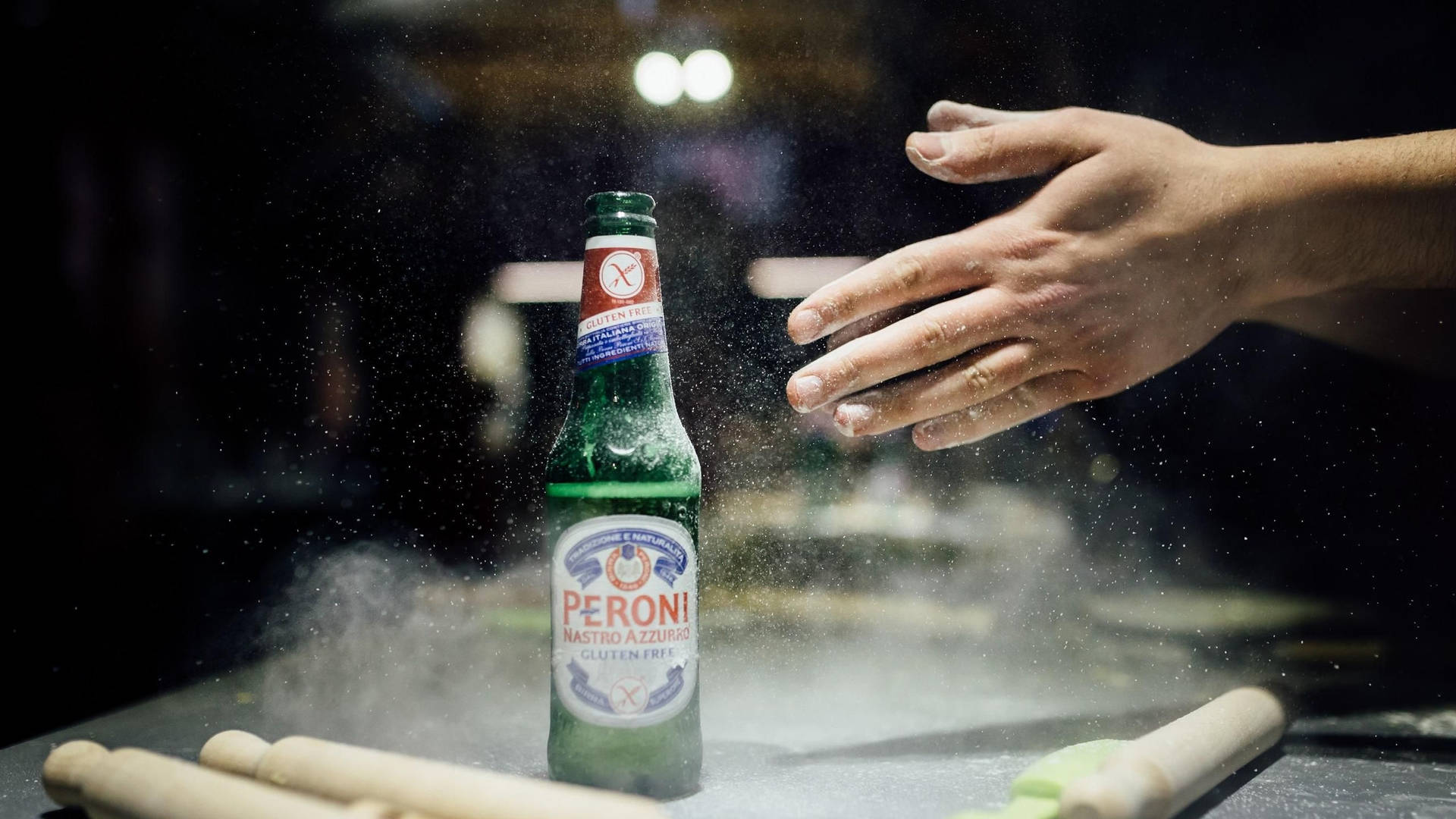 Sprinkle Of Flour On A Peroni Beer Background