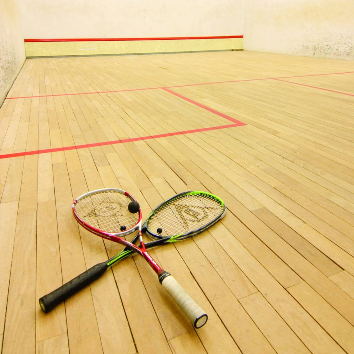 Squash Rackets On Wooden Floor