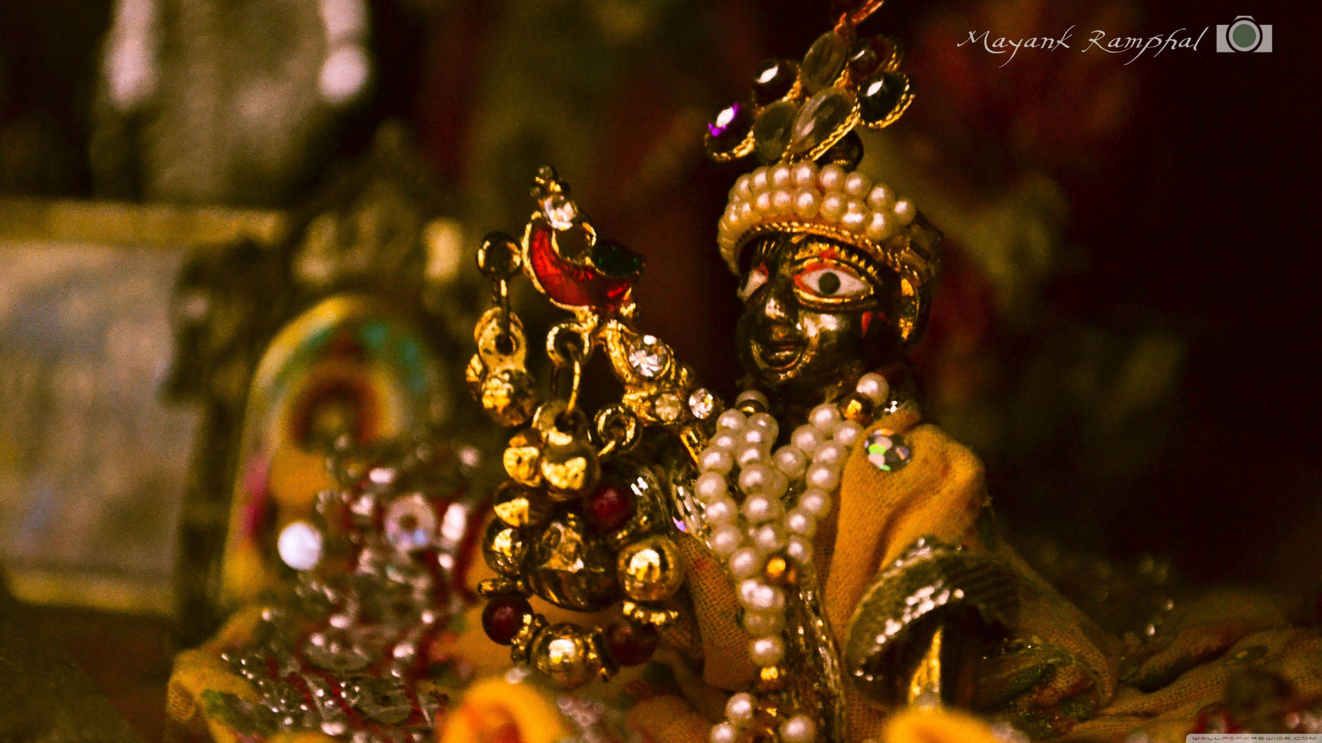 Sri Krishna Desktop Gold Statue With Pearls Background