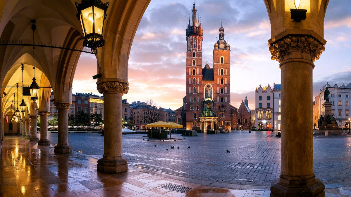 St. Mary's Basilica Viewed From Krakow Cloth Hall In Poland Background