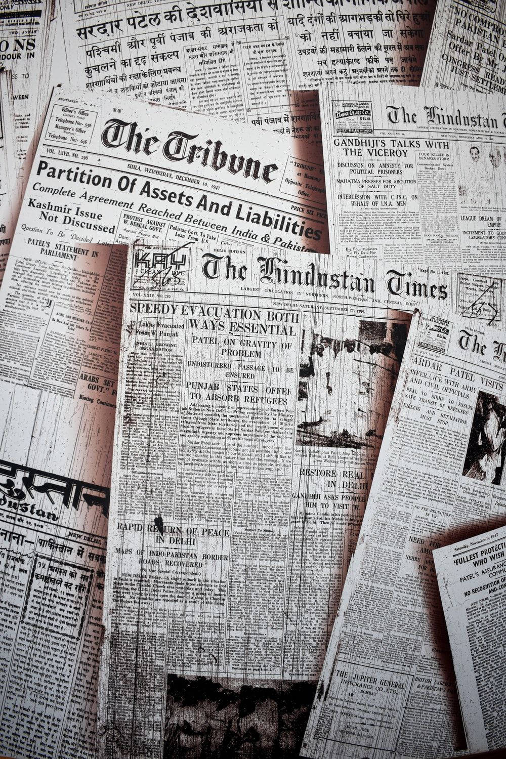 Stack Of Aged Newspapers In Monochrome Background