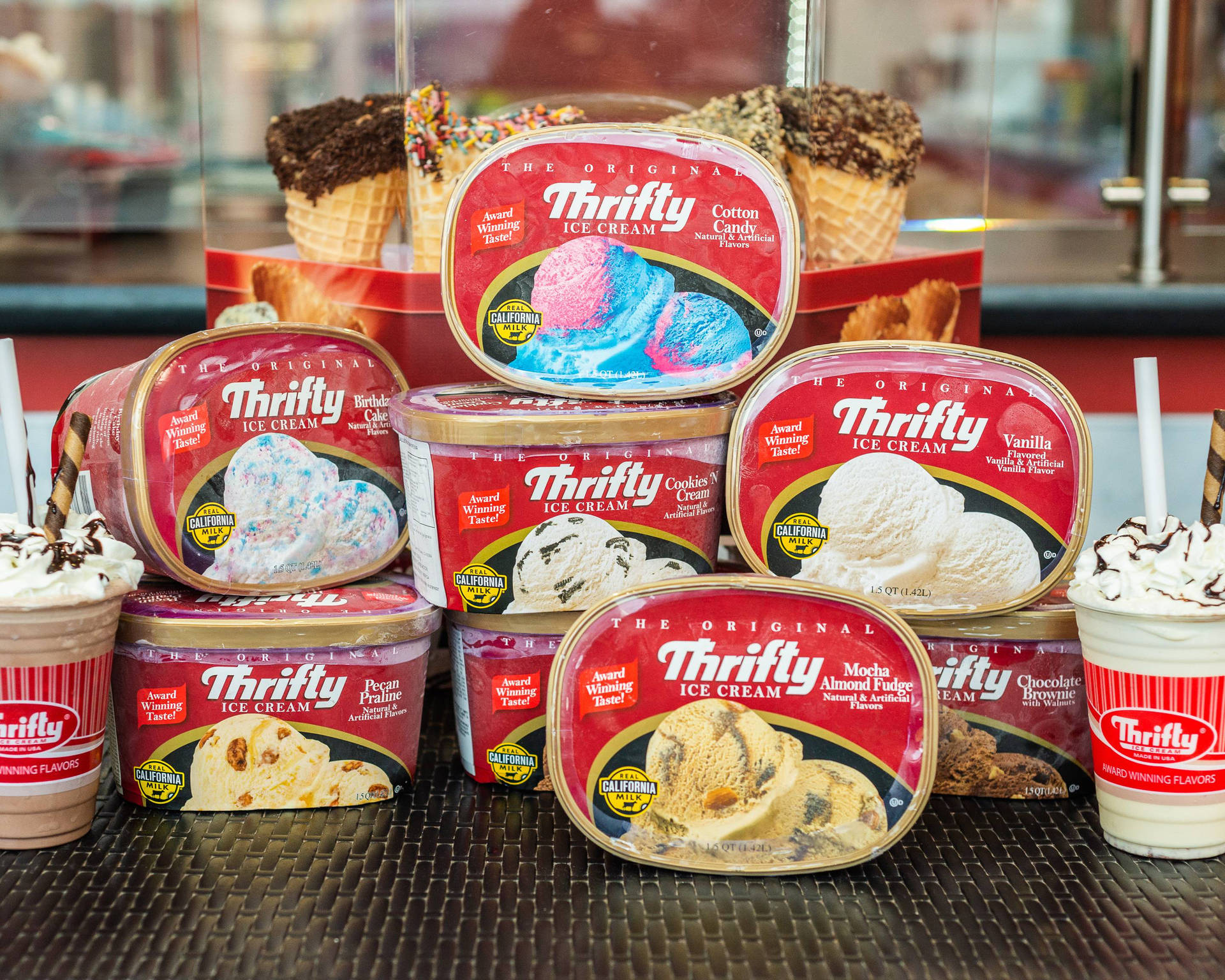 Stack Of Thrifty Ice Cream Tubs Background