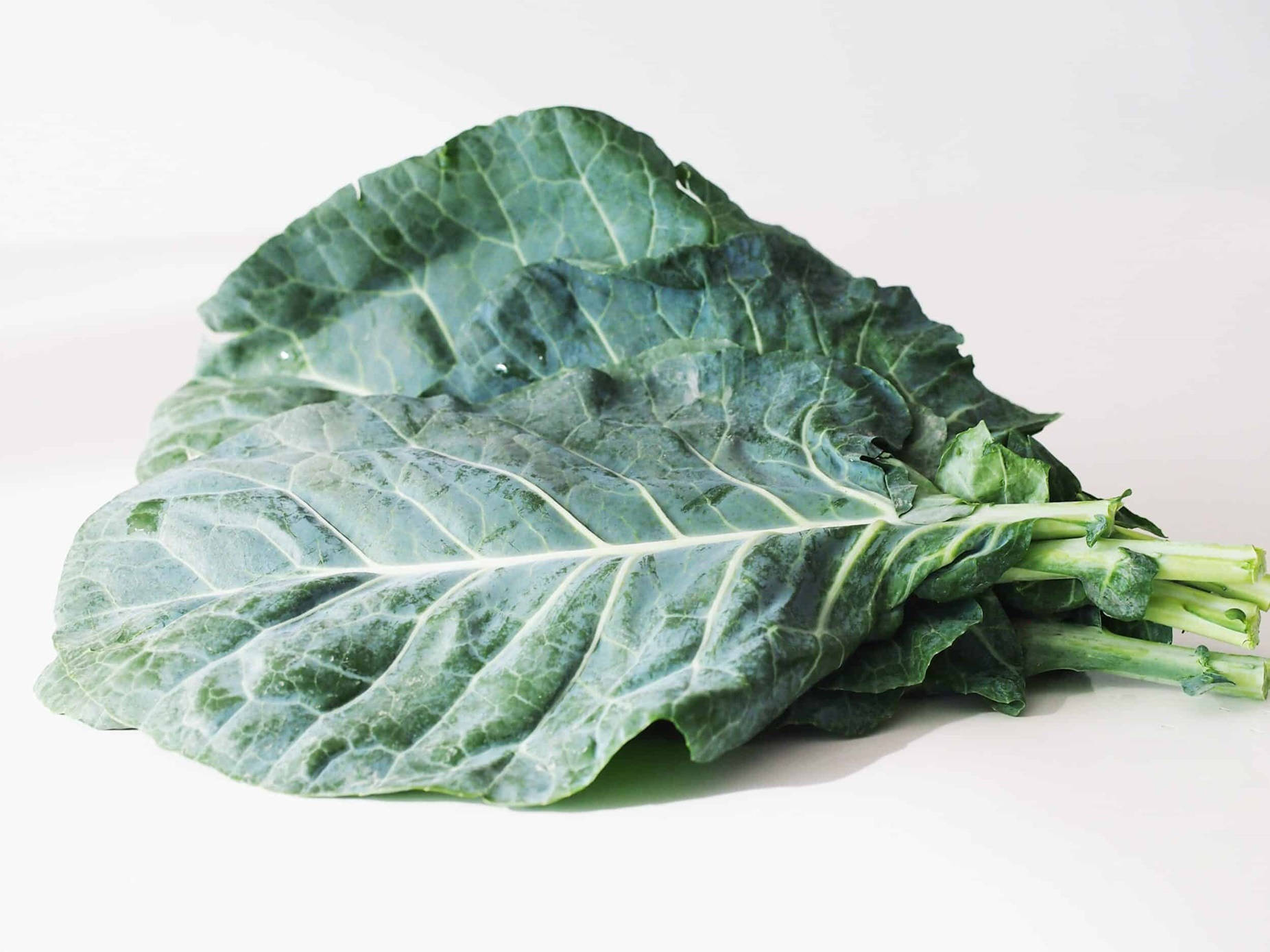 Stacked Loose Vegetable Collard Greens Background