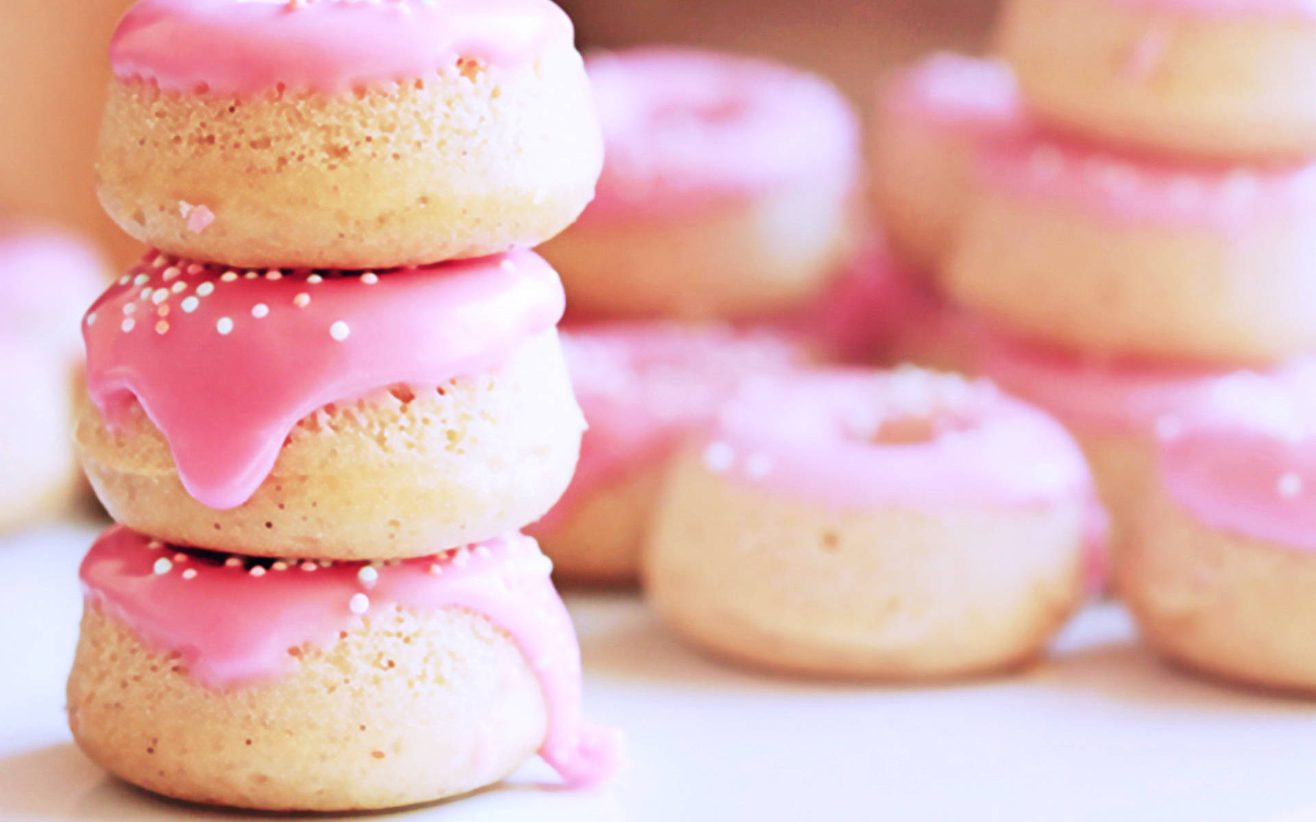 Stacked Pink Mini Donuts Background