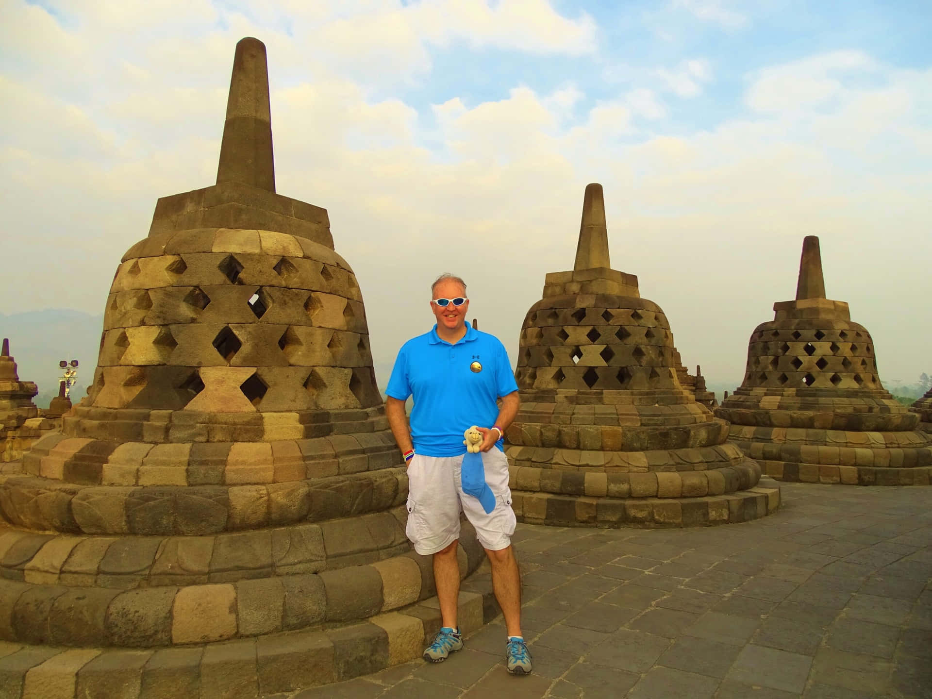 Standing Near Stupa Borobudur Temple Background