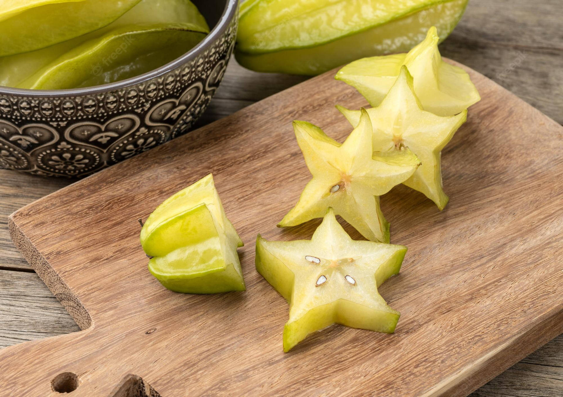 Star Fruit On Chopping Board