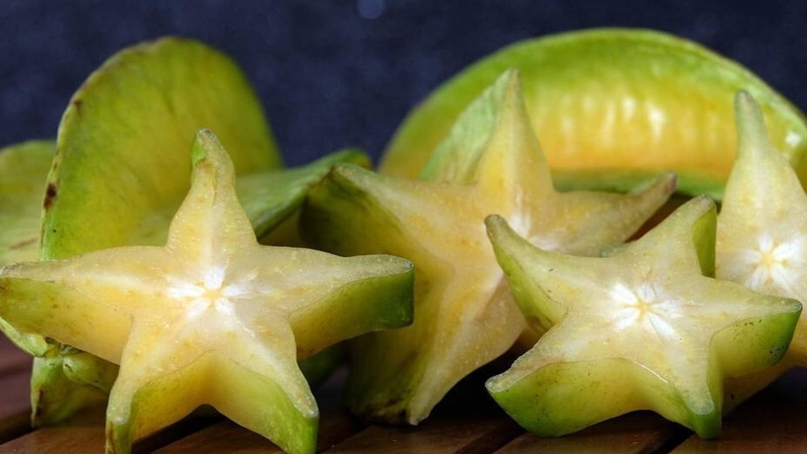 Star Fruits On The Wooden Table