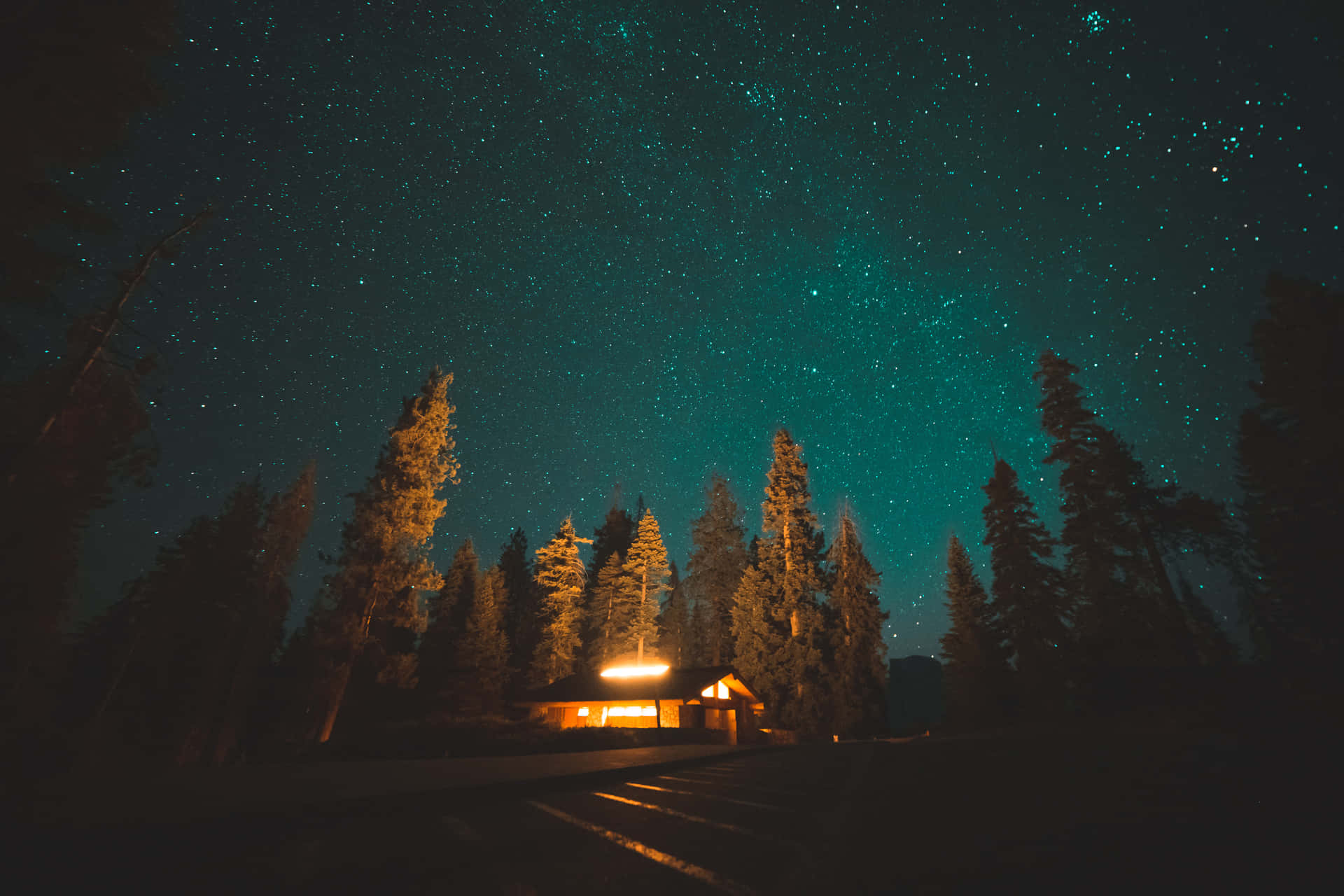 Star Sky With Cabin In Forest Background