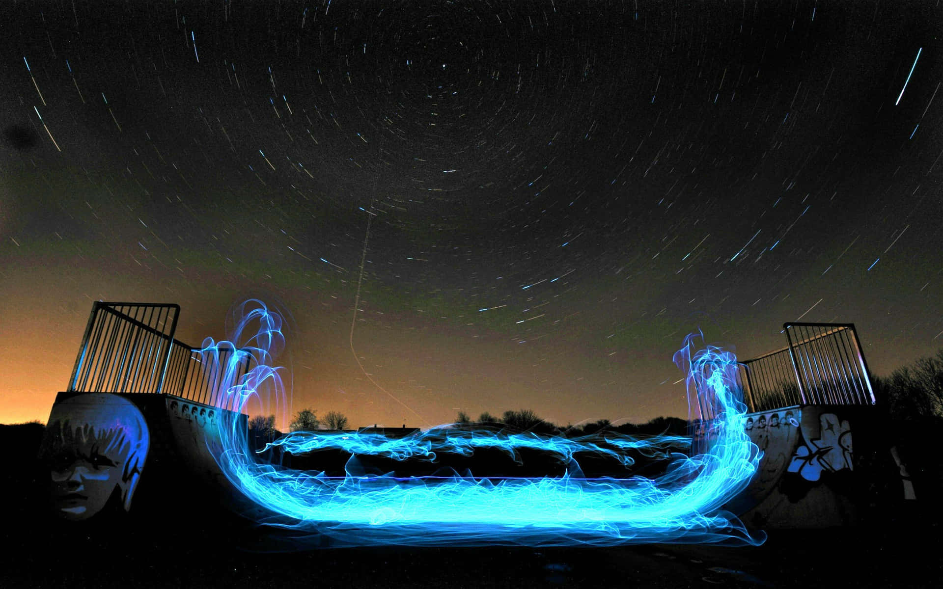 Starlit Skatepark Light Trails Background