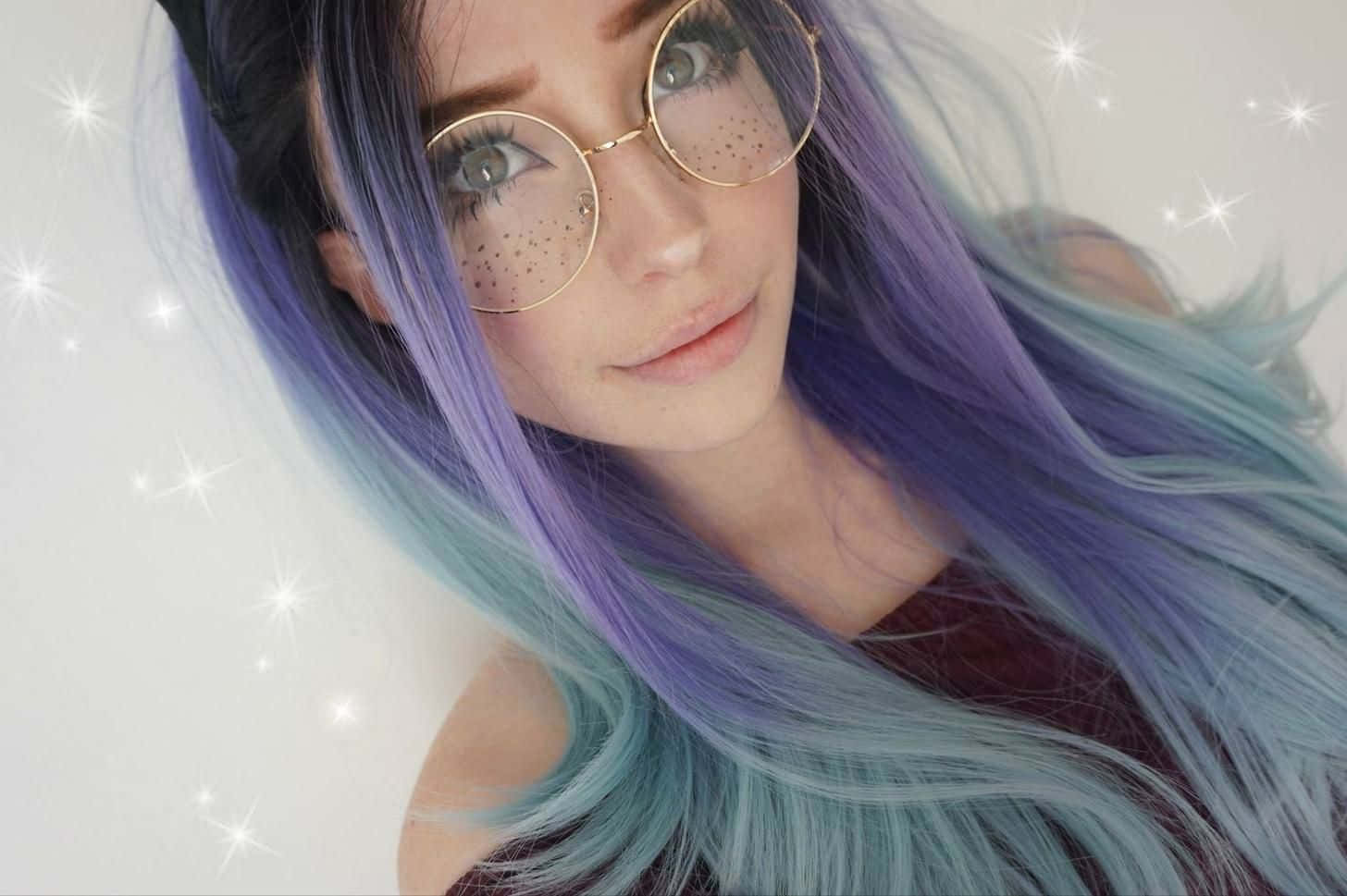 Starry Eyed Girlwith Purple Hairand Glasses Background