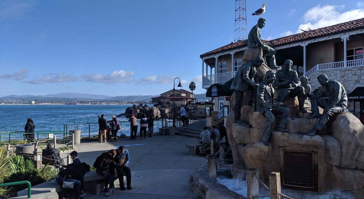 Statue Monument In Cannery Row Background