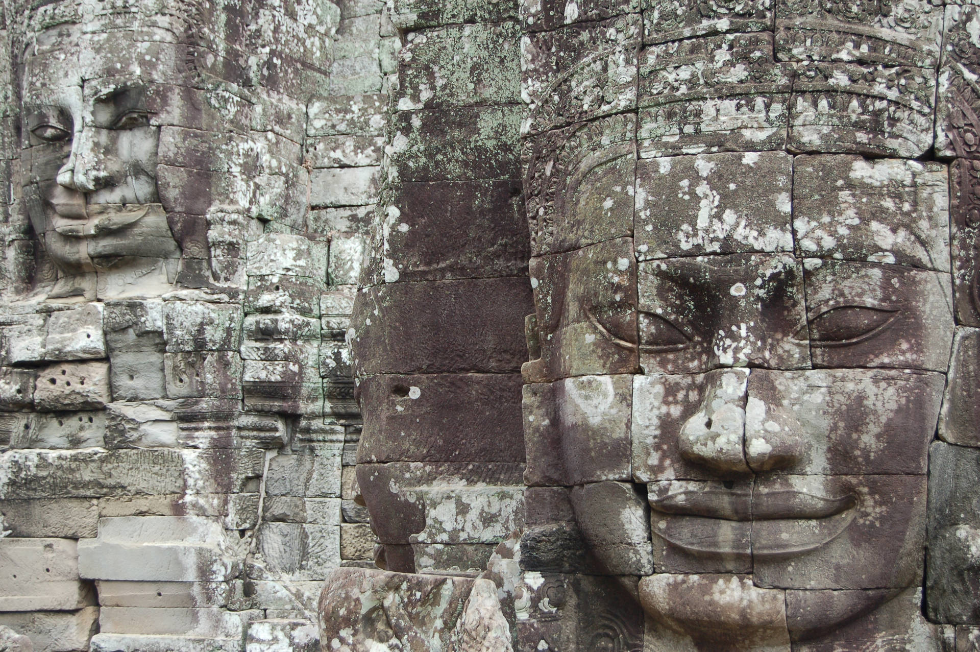 Statue Of A Face In Angkor War, Cambodia Desktop
