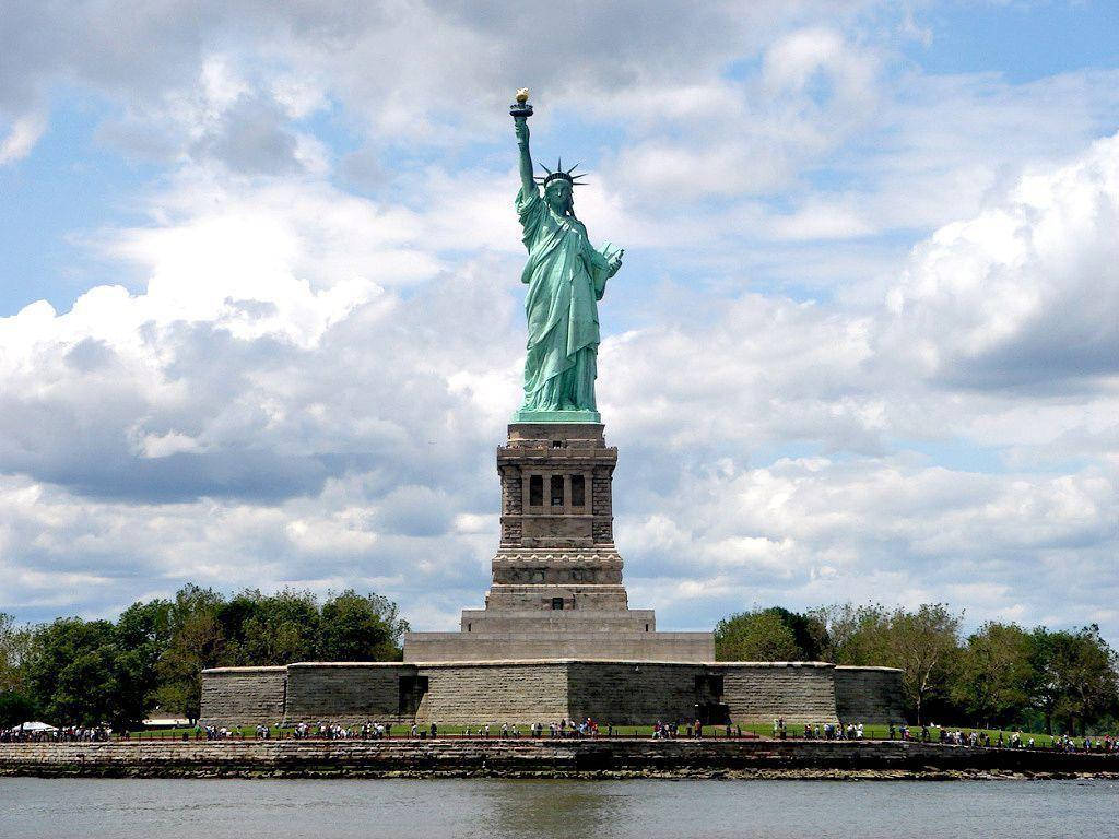 Statue Of Liberty Cloudy Day Background