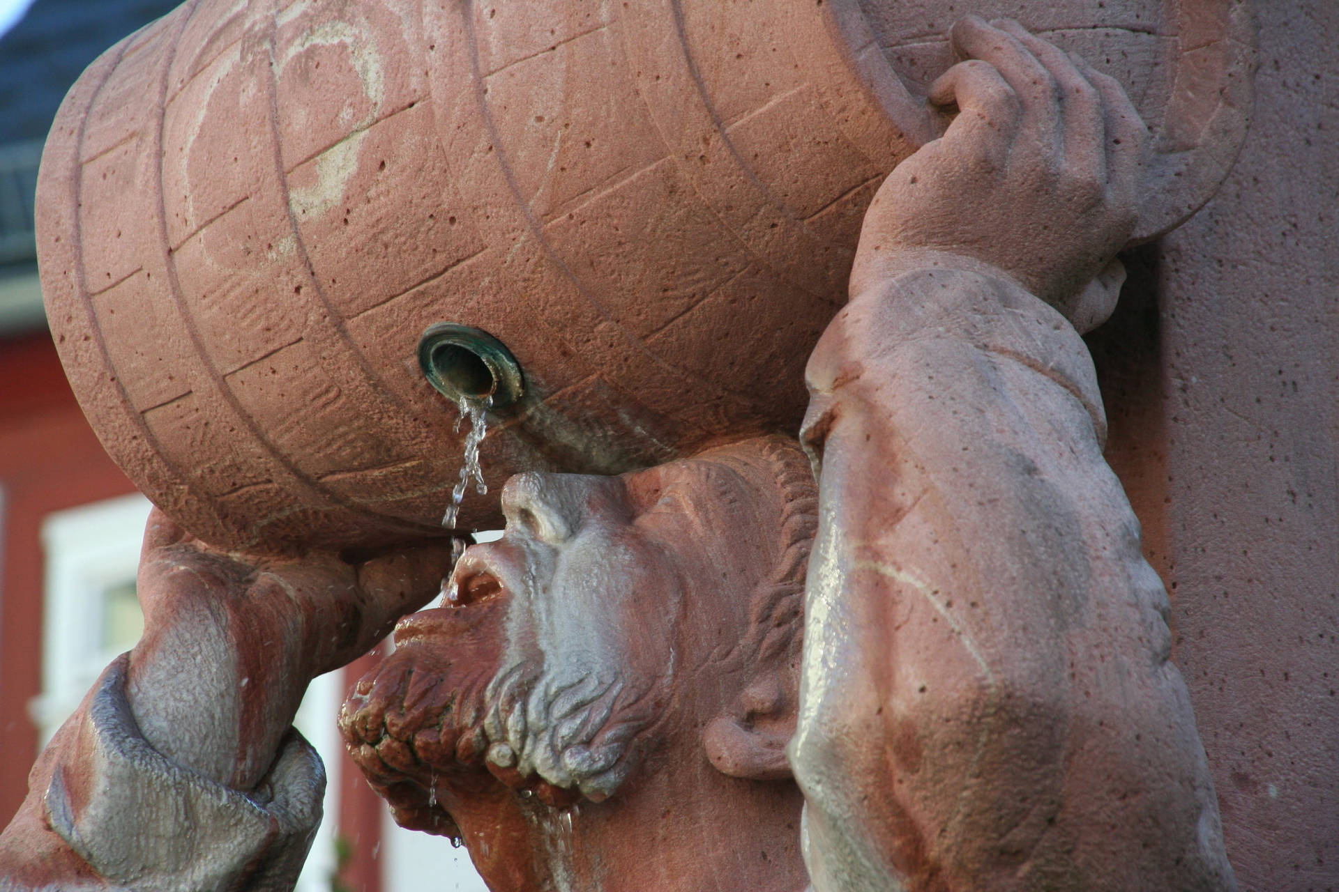 Statue Of Man Drinking Water Background