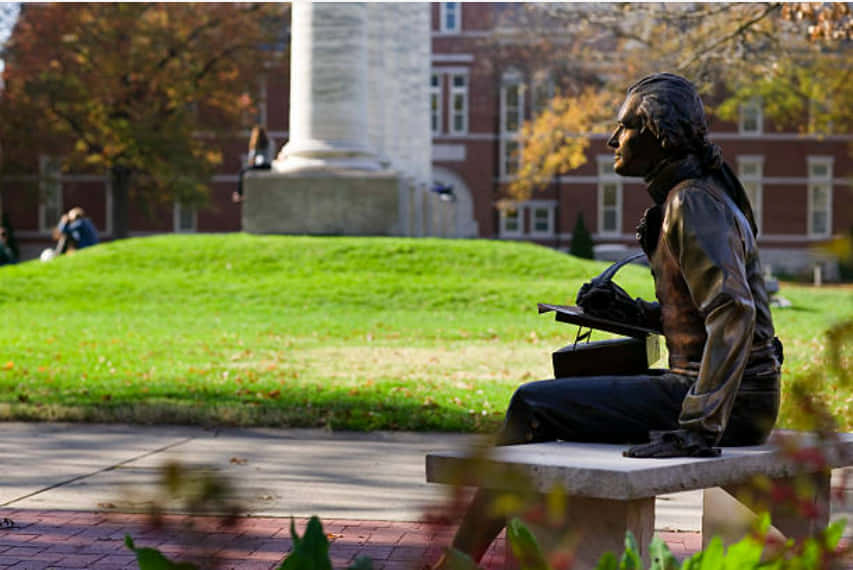 Statue Sitting On The Campus Of The University Of Missouri Background