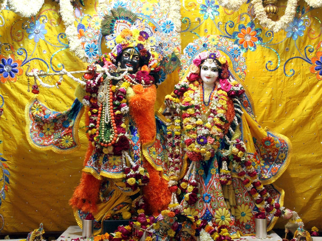 Statues Of Krishna And Radha In Iskcon Temple Background