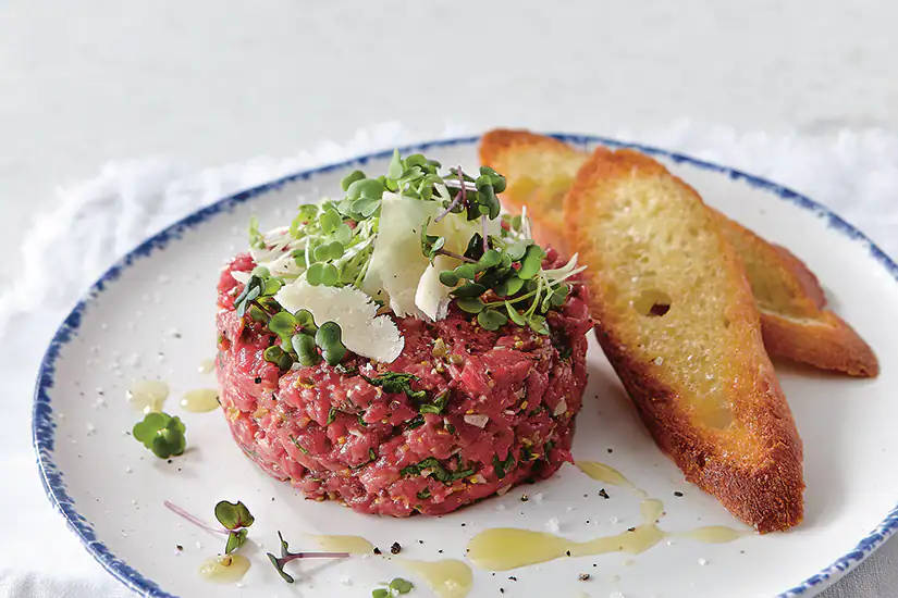 Steak Tartare With Garlic Scapes Background