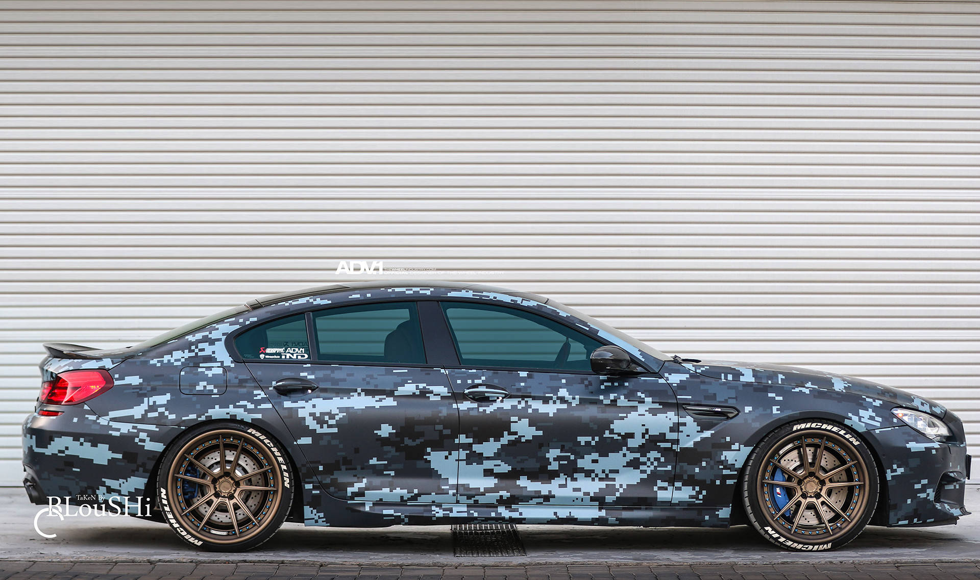Stealthy Sophistication In The Black Camouflaged Bmw M5 Background
