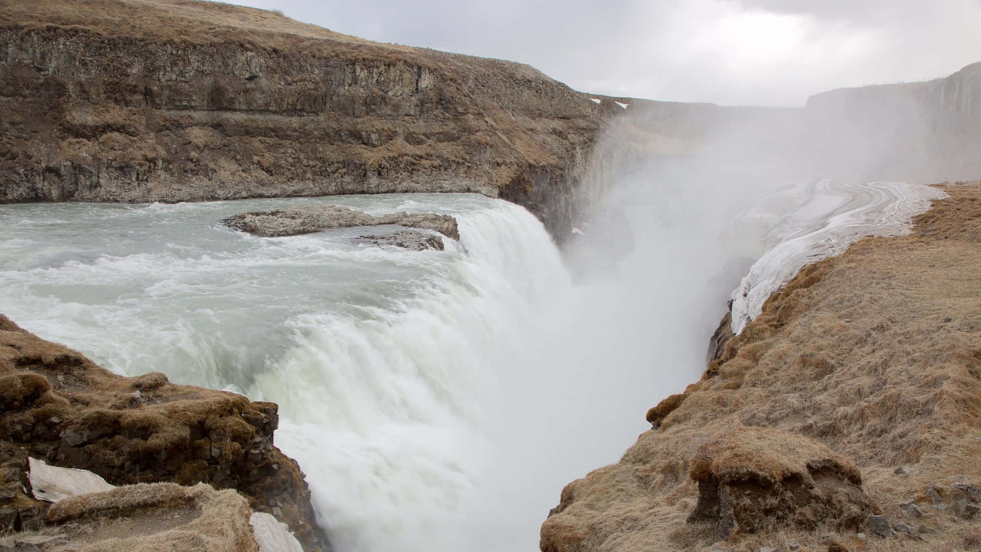 Steamy Gullfoss Waterfall In Southwest Iceland Background