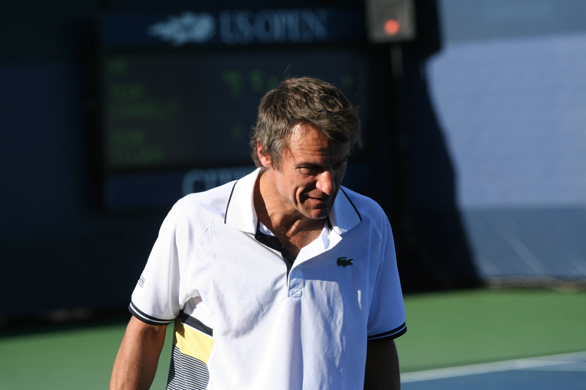 Stefan Edberg On A Tennis Court Background