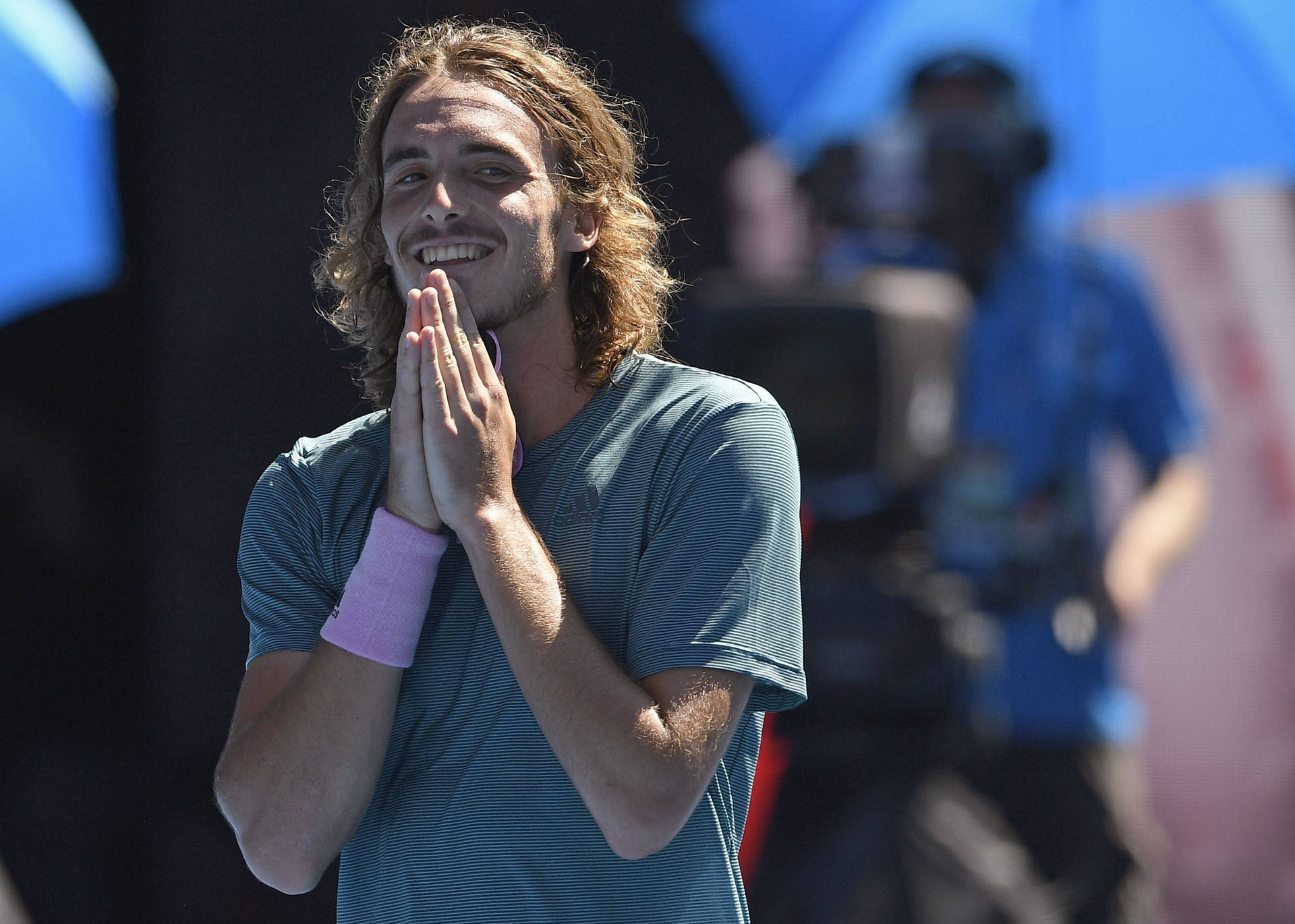 Stefanos Tsitsipas Hands Together Background