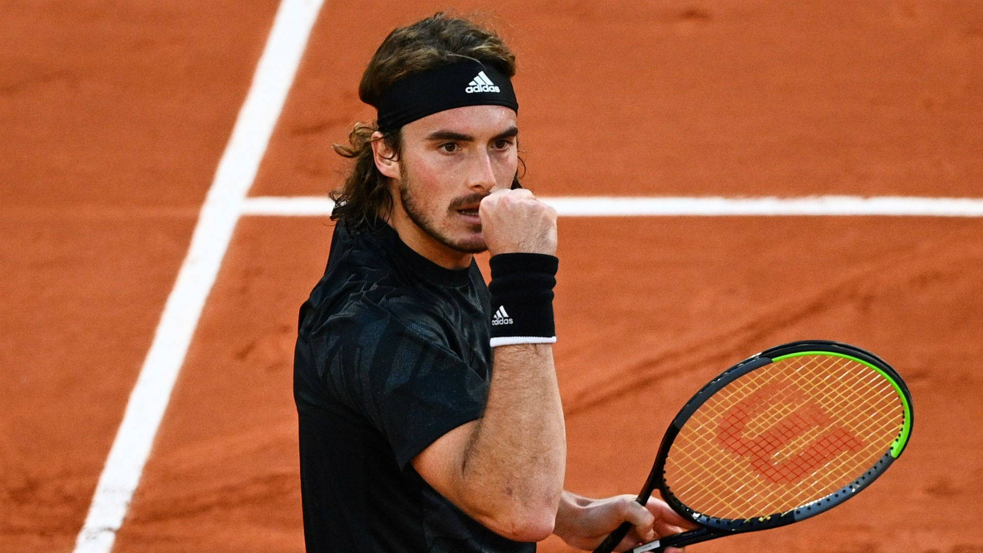 Stefanos Tsitsipas Looking Ahead Background