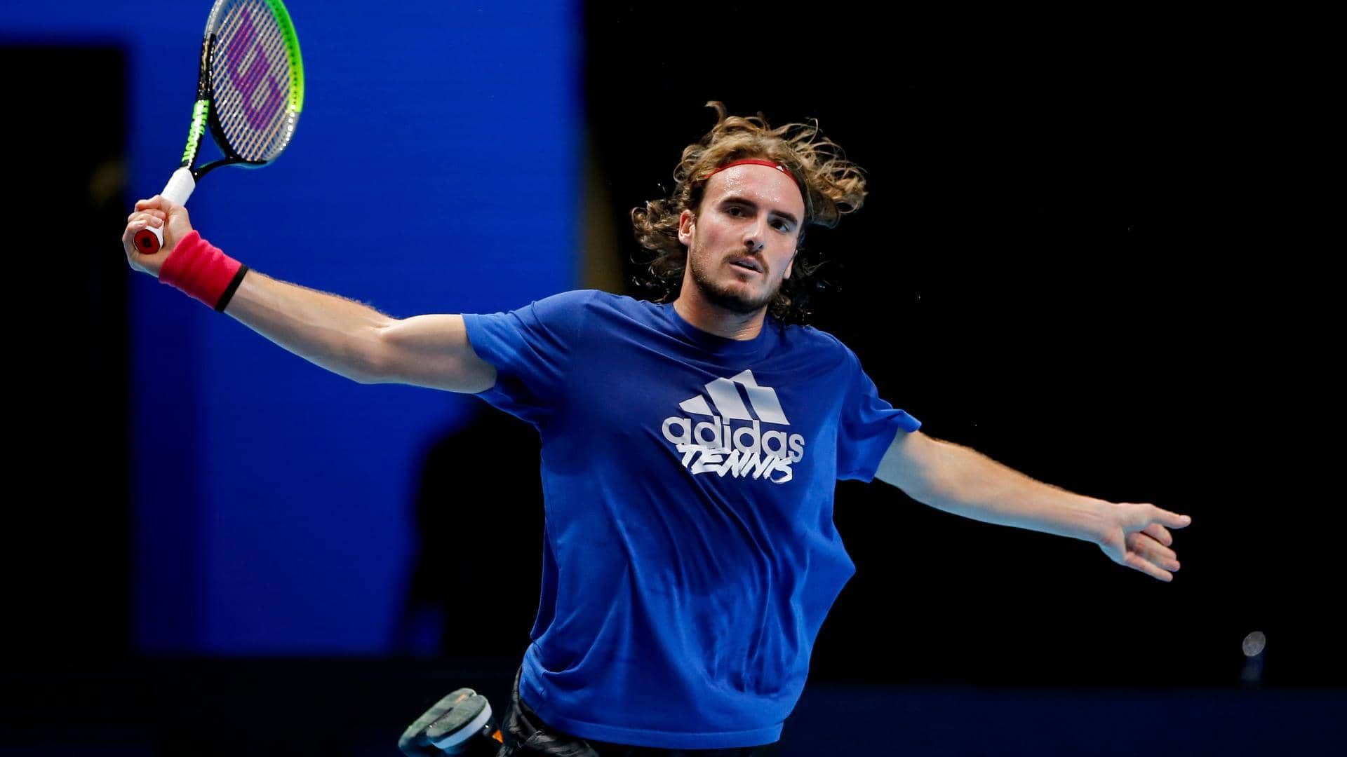 Stefanos Tsitsipas With Arms Stretched Background