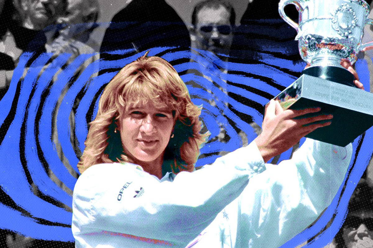 Steffi Graf Celebrating Victory With A Silver Trophy Background