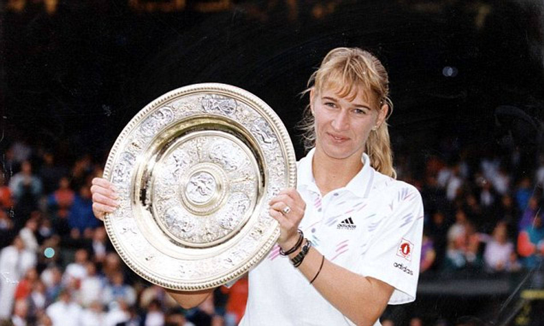 Steffi Graf Triumphantly Holding The Wimbledon Trophy