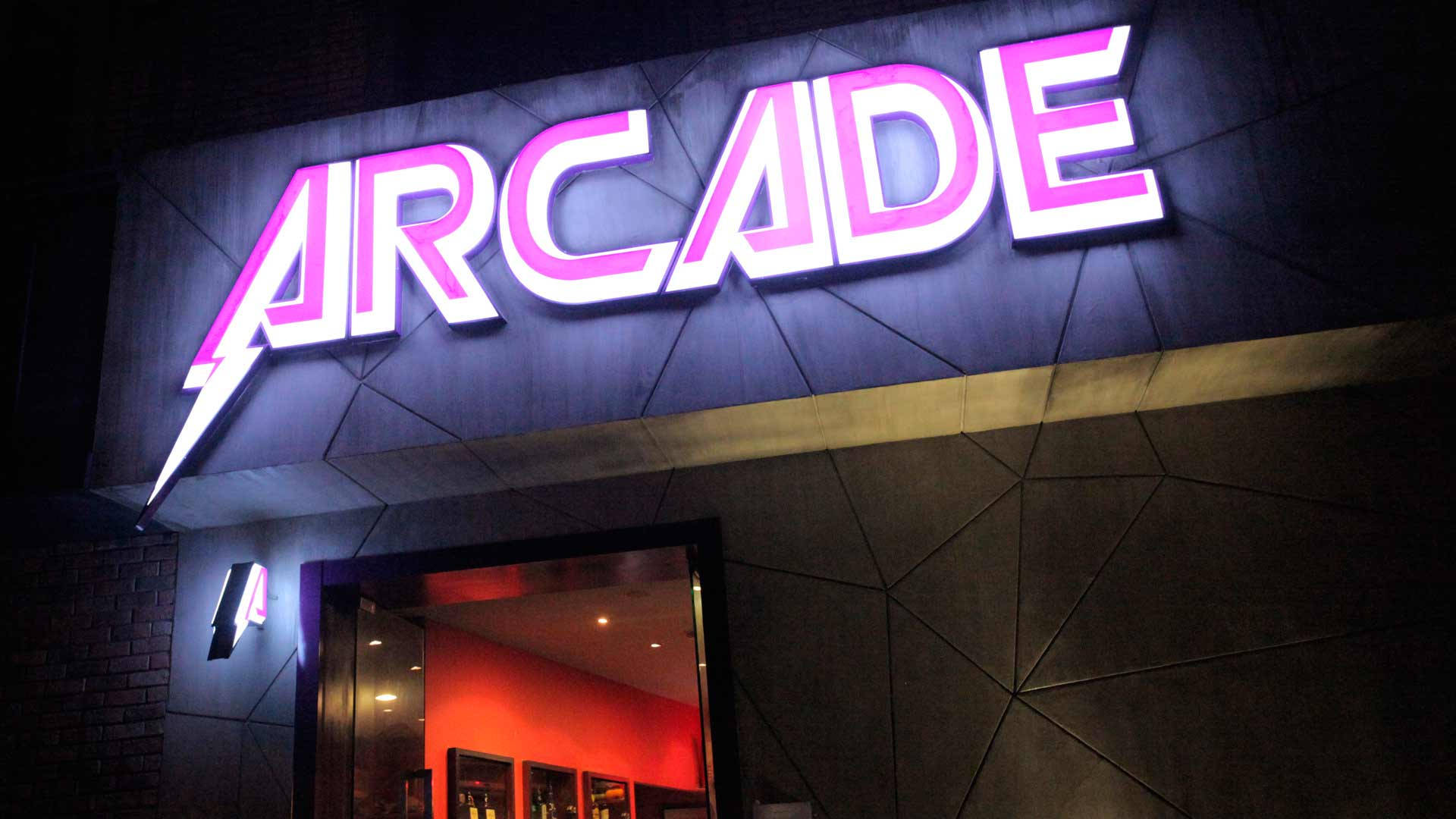 Step Inside And Enjoy A Classic Arcade Experience Background