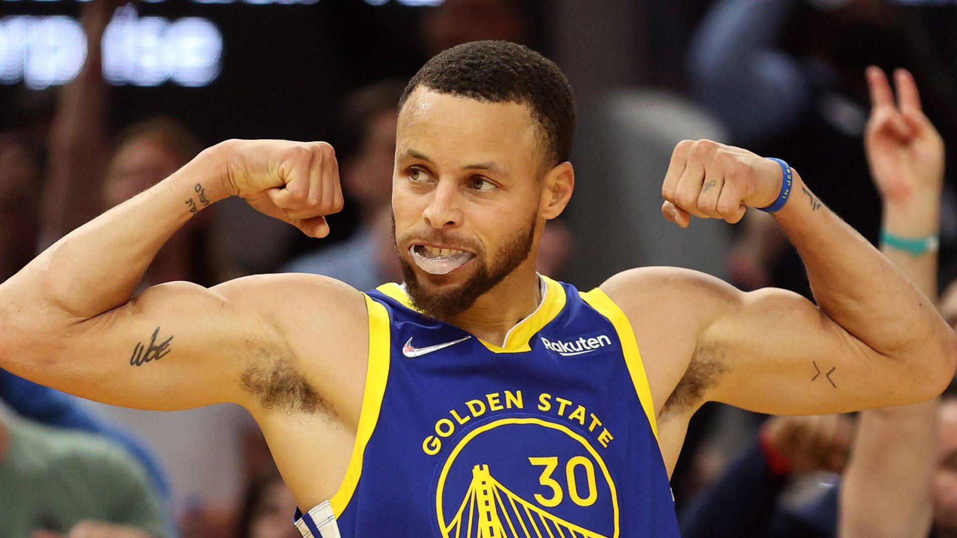 Steph Curry Doing A Muscle Pose Background