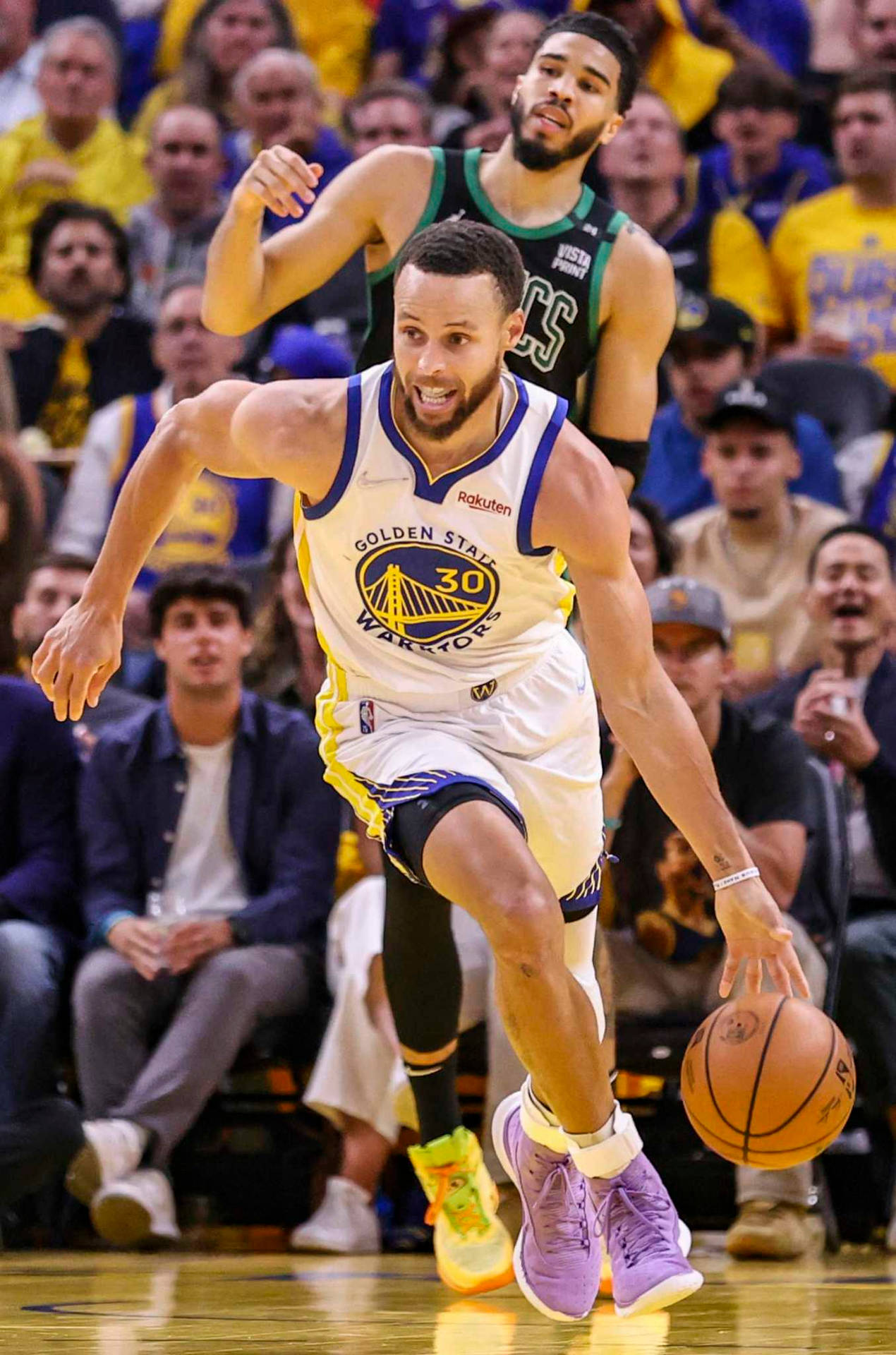 Steph Curry Dribbling A Ball During Game Background
