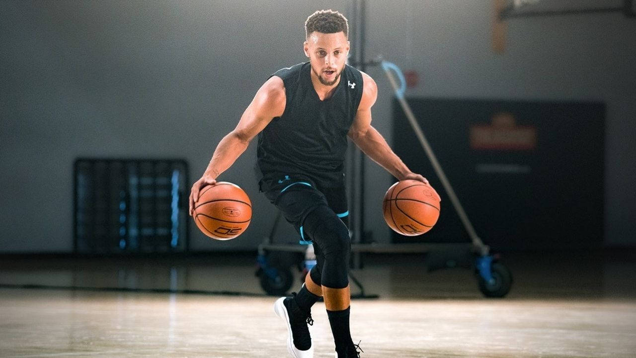 Steph Curry Dribbling Two Basketballs Background