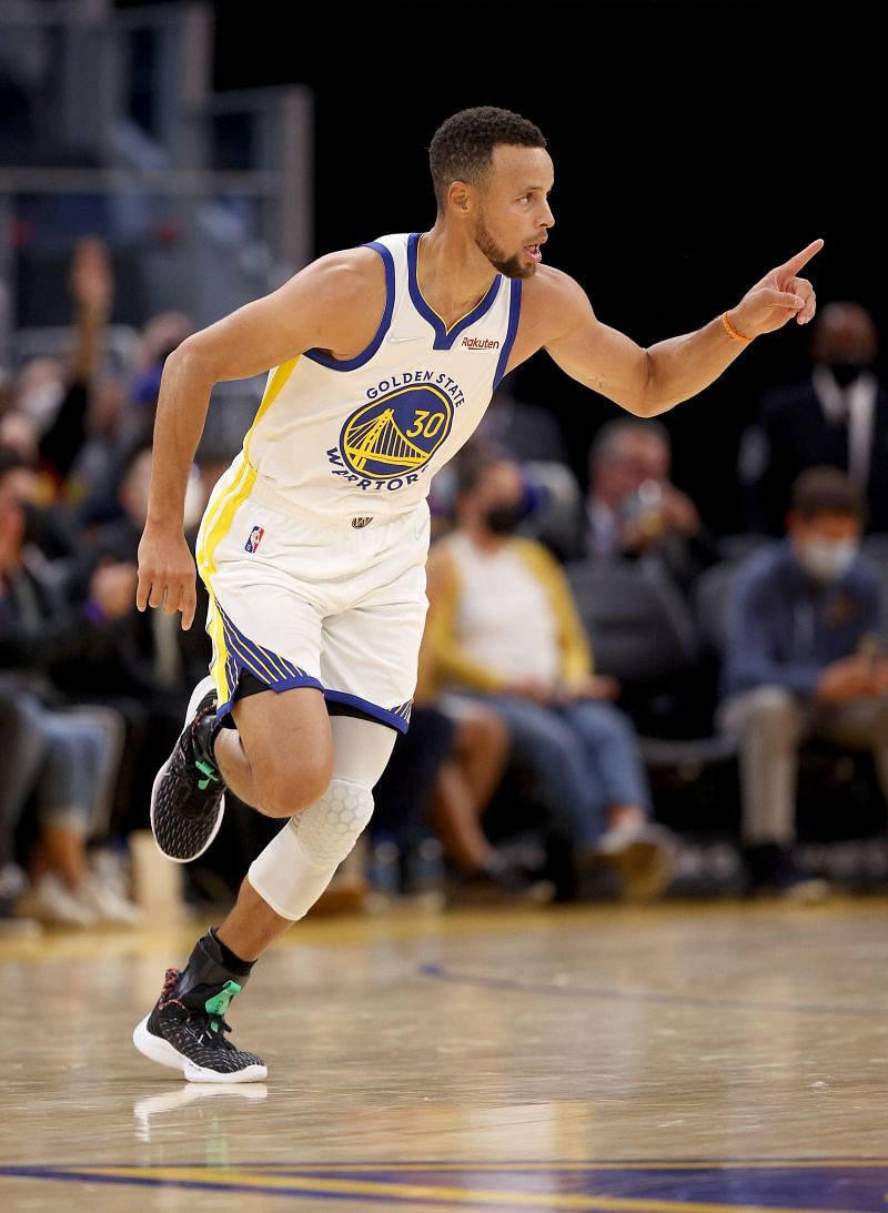 Steph Curry Pointing And Running Background