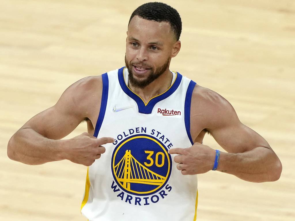 Steph Curry Pointing At Jersey Background