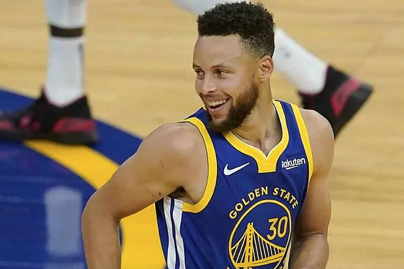 Steph Curry Smiling And Looking At Side Background