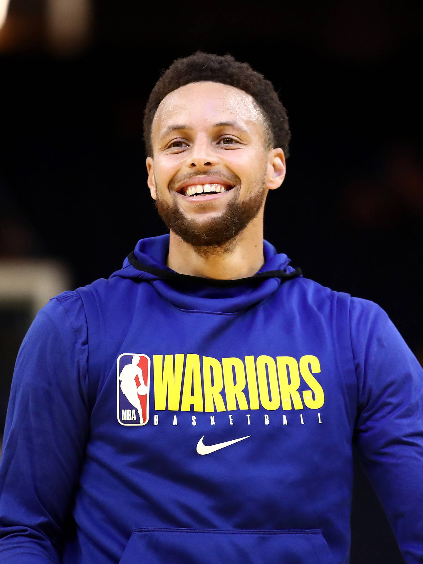 Steph Curry Wearing Blue Warriors Hoodie Background