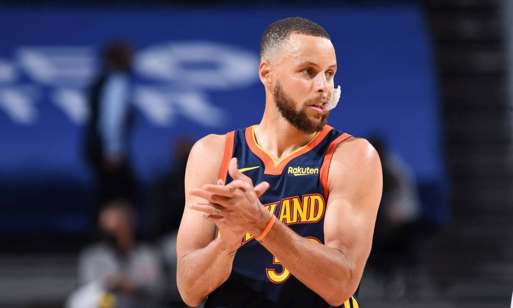 Steph Curry With Hands Together Background